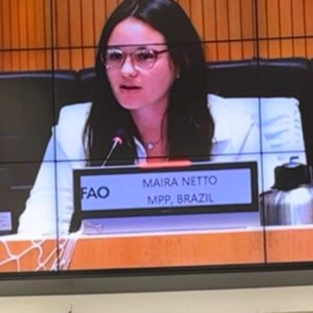 Maira testifying in an international meeting